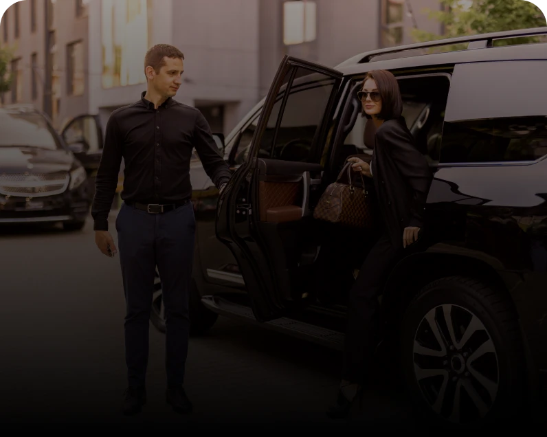 Stylish woman stepping out of car